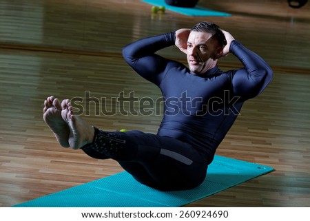 fusion of mind and body - man practicing pilates