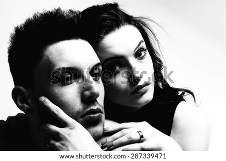 Pure passion. Perfection Indeed. Sexy passion couple, beautiful young female and male faces closeup, studio shot.