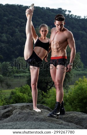 Athletic man and woman outdoor.Fashion photo