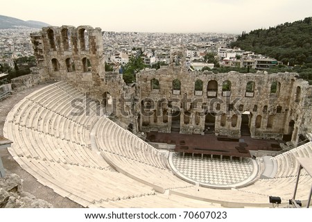 Ancient theatre of Herodes Atticus is a small building of ancient Greece used for public performances of music and poetry, below on the Acropolis and in background dwelling of metropolis Athens