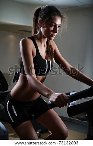 beautiful woman at the gym and smiling
