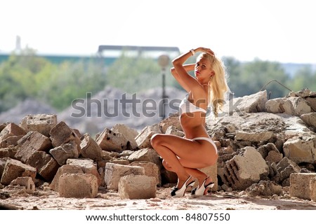 stock photo Sexy ass woman in ruins at sunset Erotic art photo