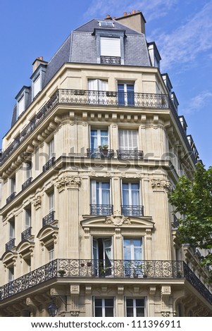 View of Unique traditional French windows and balconies. Paris, France.
