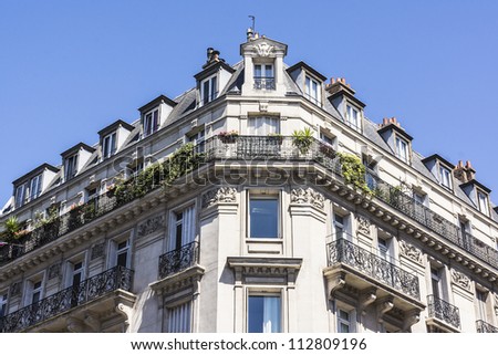 View of Unique traditional French windows and balconies. Paris, France.