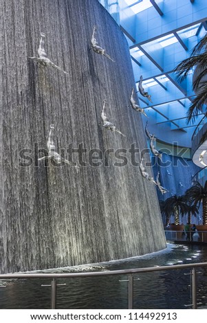 DUBAI, UAE - OCTOBER 1: Waterfall in Dubai Mall - world\'s largest shopping mall based on total area and sixth largest by gross leasable area, October 1, 2012 in Dubai, United Arab Emirates.