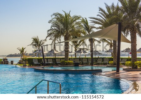 DUBAI, UAE - SEPTEMBER 29: Kempinski Hotel and Residences (129 luxury suites, penthouses and villas) on man-made island of Palm Jumeirah at September 29, 2012 in Dubai, United Arab Emirates. Pool.