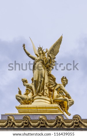 Architectural details of Opera National de Paris: Harmony roof sculpture by Charles Gumery. Grand Opera (Garnier Palace) is famous neo-baroque building in Paris, France - UNESCO World Heritage Site.