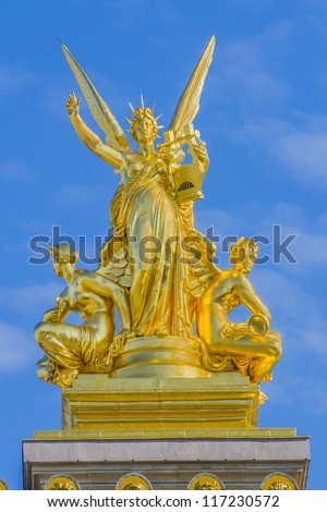Architectural details of Opera National de Paris: Harmony roof sculpture by Charles Gumery. Grand Opera (Garnier Palace) is famous neo-baroque building in Paris, France - UNESCO World Heritage Site.