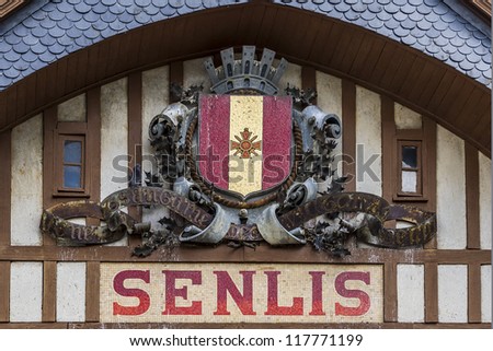 Old station building in Senlis (1922), decorated with the coat of arms. Senlis - commune in Oise department in northern France. It has a long and rich heritage, having traversed centuries of history.