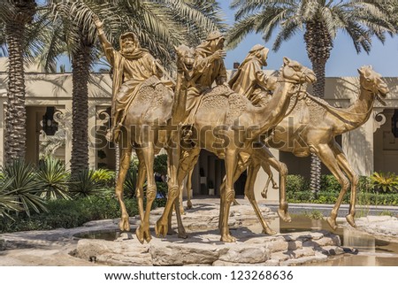 DUBAI, UAE - SEPTEMBER 30: Huge gold camels decorated entrance in 5 star hotel One&Only Royal Mirage (451 rooms, 65 acres of lush green lawns, 1 km beachfront), at September 30, 2012 in Dubai, UAE.