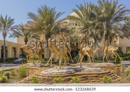 DUBAI, UAE - SEPTEMBER 30: Huge gold camels decorated entrance in 5 star hotel One&Only Royal Mirage (451 rooms, 65 acres of lush green lawns, 1 km beachfront), at September 30, 2012 in Dubai, UAE.