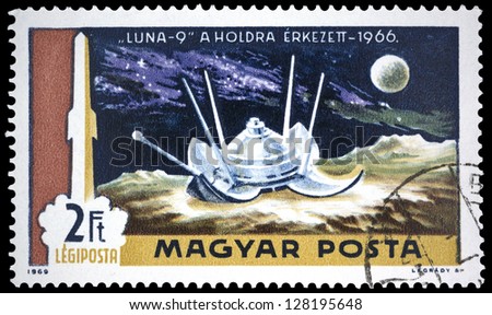 HUNGARY - CIRCA 1969: A stamp printed in Hungary shows rockets picture, Moon and satellite Luna 9 Landing on Moon, with inscription \