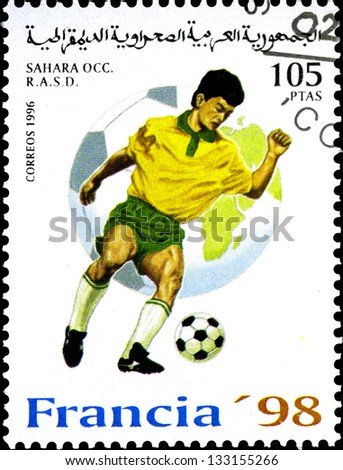 SAHARA - CIRCA 1996: A stamp printed in Sahrawi Arab Democratic Republic, shows a football player, with inscription \