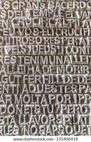 BARCELONA - JAN 17: Words from Bible in different languages, which are written above entrance to cathedral Sagrada Familia (designed by Antoni Gaudi) on January 17, 2013 in Barcelona, Catalonia, Spain
