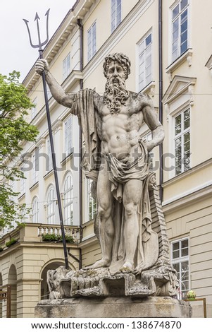 An ancient statue of Neptune in the central square of Lviv - Market (Rynok) Square near City Hall. Lviv - city in western Ukraine, capital of historical region Galicia