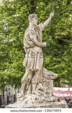 An ancient statue of Adonis in the central square of Lviv - Market (Rynok) Square near City Hall. Lviv - city in western Ukraine, capital of historical region Galicia