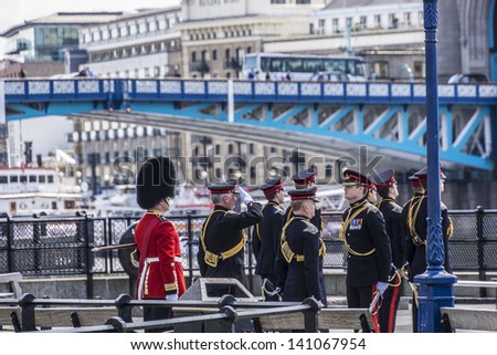 LONDON - JUNE 03: City of London\'s Territorial Army regiment perform a 62-round Royal Salute from Gun Wharf at Tower, to mark 60 Anniversary of Coronation of Queen Elizabeth on June 03, 2013 in London