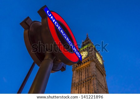 LONDON - MAY 31: Night view of London Underground subway sign in front of famous Clock Tower (now officially called the Elizabeth Tower) with bell Big Ben at Westminster, on May 31, 2013 in London