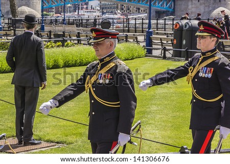 LONDON - JUNE 03: City of London\'s Territorial Army regiment perform a 62-round Royal Salute from Gun Wharf at Tower, to mark 60 Anniversary of Coronation of Queen Elizabeth on June 03, 2013 in London