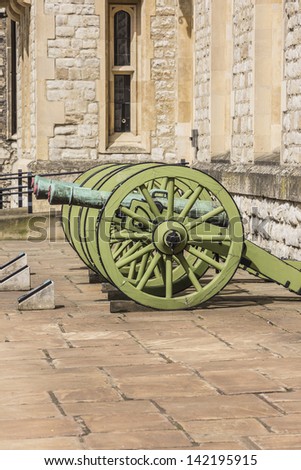 Old battle cannon in Tower of London - historic castle on the north bank of the River Thames in central London - a popular tourist attraction.