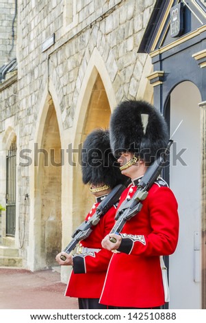 WINDSOR, ENGLAND - MAY 27: Changing Guard takes place in Windsor Castle on May 27, 2013, Windsor, England. British Guards in red uniforms are among the most famous in the world.