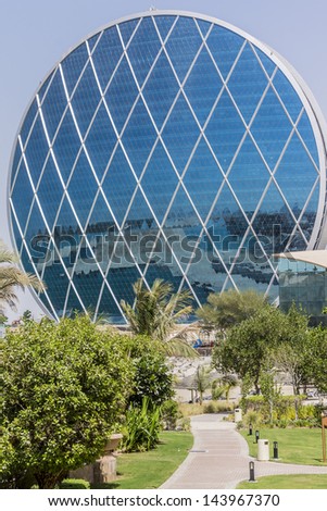 ABU DHABI, UAE - OCT 1: View of Aldar headquarters building - first circular building in Middle East, at October 1, 2012, Abu Dhabi, UAE. It was voted Best Futuristic Design by Building Conference.
