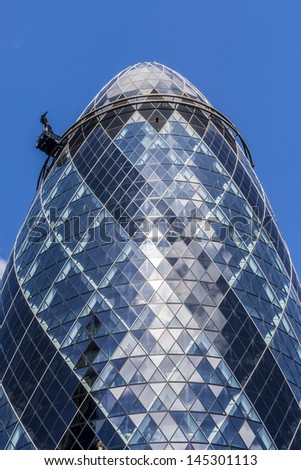 LONDON - JUNE 3: View of Gherkin building (or 30 St Mary Axe, 2004) in London on June 3, 2013. Gherkin - iconic symbol of London, one of city\'s most widely recognized examples of modern architecture.
