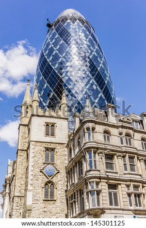 LONDON - JUNE 3: View of Gherkin building (or 30 St Mary Axe, 2004) in London on June 3, 2013. Gherkin - iconic symbol of London, one of city\'s most widely recognized examples of modern architecture.