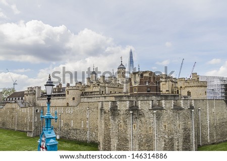 Tower of London (Her Majesty\'s Royal Palace and Fortress) - historic castle on the north bank of the River Thames in central London - a popular tourist attraction. View of Tower from outside walls.