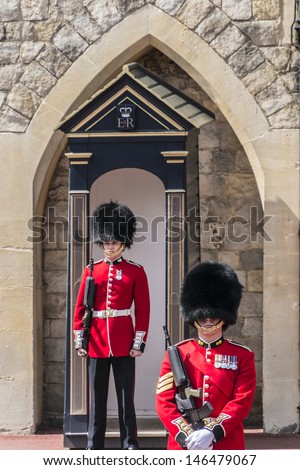 WINDSOR, ENGLAND - MAY 27: Changing Guard Ceremony takes place in Windsor Castle on May 27, 2013, Windsor, England. British Guards in red uniforms are among the most famous in the world.