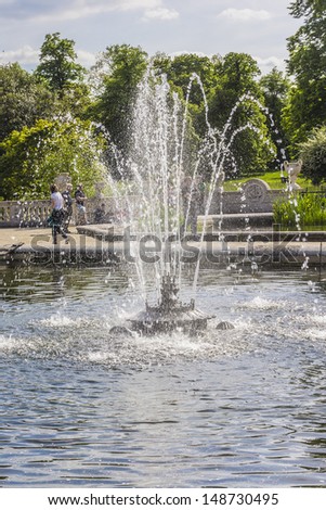 LONDON - JUNE 2: View of Italian Gardens in Kensington Gardens on June 2, 2013 in London. Kensington Gardens - one of Royal Parks of London. Italian Gardens is a 150-year old ornamental water garden.