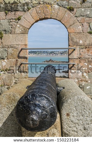Elizabeth Castle (1594) - castle and tourist attraction on a tidal island within parish of Saint Helier, Jersey, UK. Antique cannon.