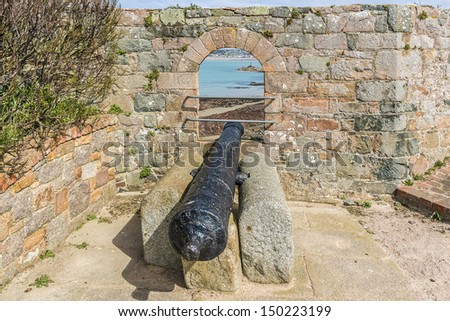 Elizabeth Castle (1594) - castle and tourist attraction on a tidal island within parish of Saint Helier, Jersey, UK. Antique cannon.