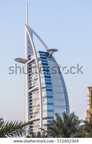 DUBAI, UAE - SEPTEMBER 29: View of Burj al Arab hotel (7 star, 1999) from territory of Madinat Jumeirah hotel at September 29, 2012, Dubai, United Arab Emirates. Madinat Jumeirah - luxury 5 star hotel
