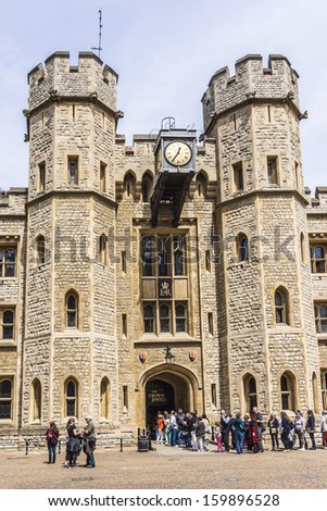 TOWER OF LONDON, UK -Â?Â? MAY 26, 2013: Many visitors to Crown Jewels gallery (Waterloo Barracks) in Her MajestyÃ¢Â?Â?s Royal Palace and Fortress Tower of London - a very popular tourist attraction.