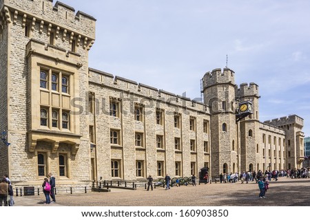 TOWER OF LONDON, UK -Â?Â? MAY 26, 2013: Many visitors to Crown Jewels gallery (Waterloo Barracks) in Her MajestyÃ¢Â?Â?s Royal Palace and Fortress Tower of London - a very popular tourist attraction.
