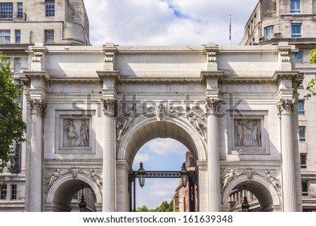 Architectural fragment of Marble Arch - 19th-century white marble faced triumphal arch and London landmark. Marble Arch was designed by John Nash in 1827. West End, London, England.