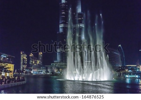 DUBAI, UAE - OCTOBER 1, 2012: A record-setting fountain system set on Burj Khalifa Lake - 6600 lights and 25 projectors, it shoots water 150 m into the air. United Arab Emirate.