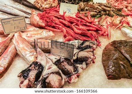 BARCELONA, SPAIN - NOVEMBER 16, 2013: Famous La Boqueria market - one of the oldest markets (Established in 1217) in Europe that still exist. A huge selection of seafood.