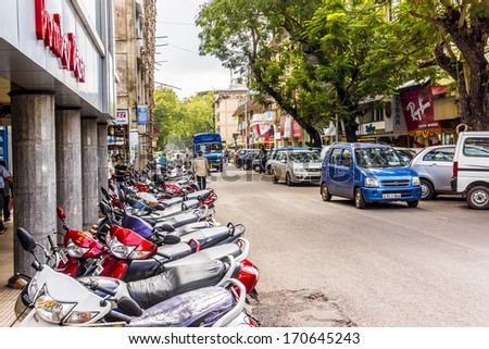 PANJIM, GOA, INDIA - SEPTEMBER 30, 2013: View of streets of the capital of the Goa state: old houses and traffic. Panjim (Panaji) - capital of Indian state of Goa and Goa\'s largest city.