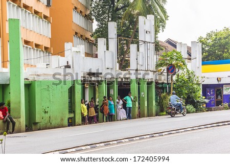 PANJIM, GOA, INDIA - SEPTEMBER 30, 2013: View of streets of the capital of the Goa state: old houses and traffic. Panjim (Panaji) - capital of Indian state of Goa and Goa's largest city.
