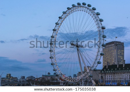 LONDON, UK - MARCH 17, 2013: View of the London Eye at evening. London Eye - a famous tourist attraction over river Thames in the capital city London.