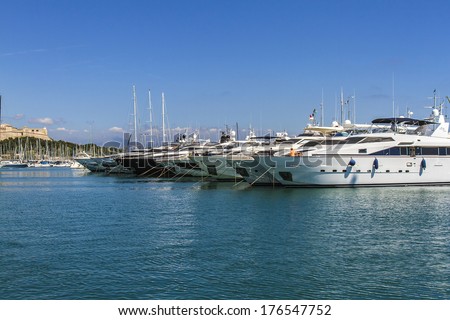 ANTIBES, FRANCE Ã¢Â?Â? AUGUST 30, 2012: Super yachts on the coast of Antibes. Antibes is a resort town in the Alps-Maritimes department in southeastern France between Cannes and Nice, Cote d'Azur.