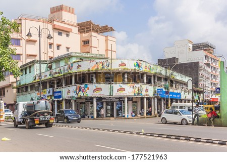 PANJIM, GOA, INDIA - SEPTEMBER 30, 2013: View of streets of the capital of the Goa state: old and new houses and traffic. Panjim (Panaji) - capital of Indian state of Goa and Goa\'s largest city.