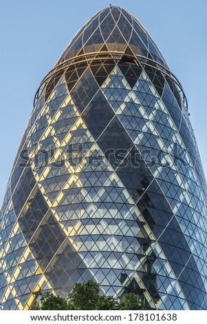 LONDON - JUNE 3, 2013: View of Gherkin building (30 St Mary Axe) at sunset in London. Gherkin - iconic symbol of London, one of city's most widely recognized examples of modern architecture.