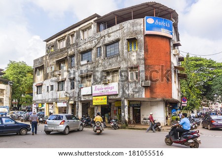 PANJIM, GOA, INDIA - SEPTEMBER 30, 2013: View of streets of the capital of the Goa state: old houses and traffic. Panjim (Panaji) - capital of Indian state of Goa and Goa\'s largest city.