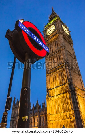 LONDON, UK - MAY 31, 2013: Night view of London Underground subway sign in front of famous Clock Tower (now officially called the Elizabeth Tower) with bell Big Ben at Westminster in London.