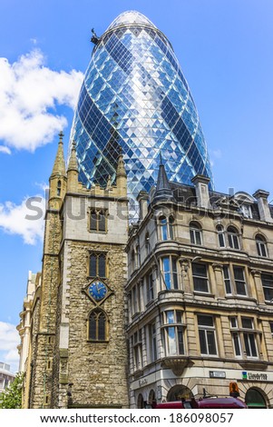 LONDON, UK - JUNE 3, 2013: View of Gherkin building (or 30 St Mary Axe, 2004) in London. Gherkin - iconic symbol of London, one of city\'s most widely recognized examples of modern architecture.