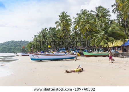 COLVA BEACH, GOA, INDIA - SEPTEMBER 22, 2013: Colva beach consists about 25 km of finest powder white sand. Colva beaches are one of busiest places and tourist attraction places of rest in south Goa.