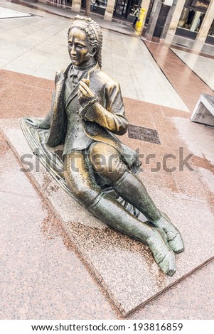 ZARAGOZA, SPAIN - NOVEMBER 21, 2013: Bronze sculpture dedicated to painter Francisco de Goya (by Federico Mares, 1960) at Pilar Square, behind Town Hall and Pilar church.